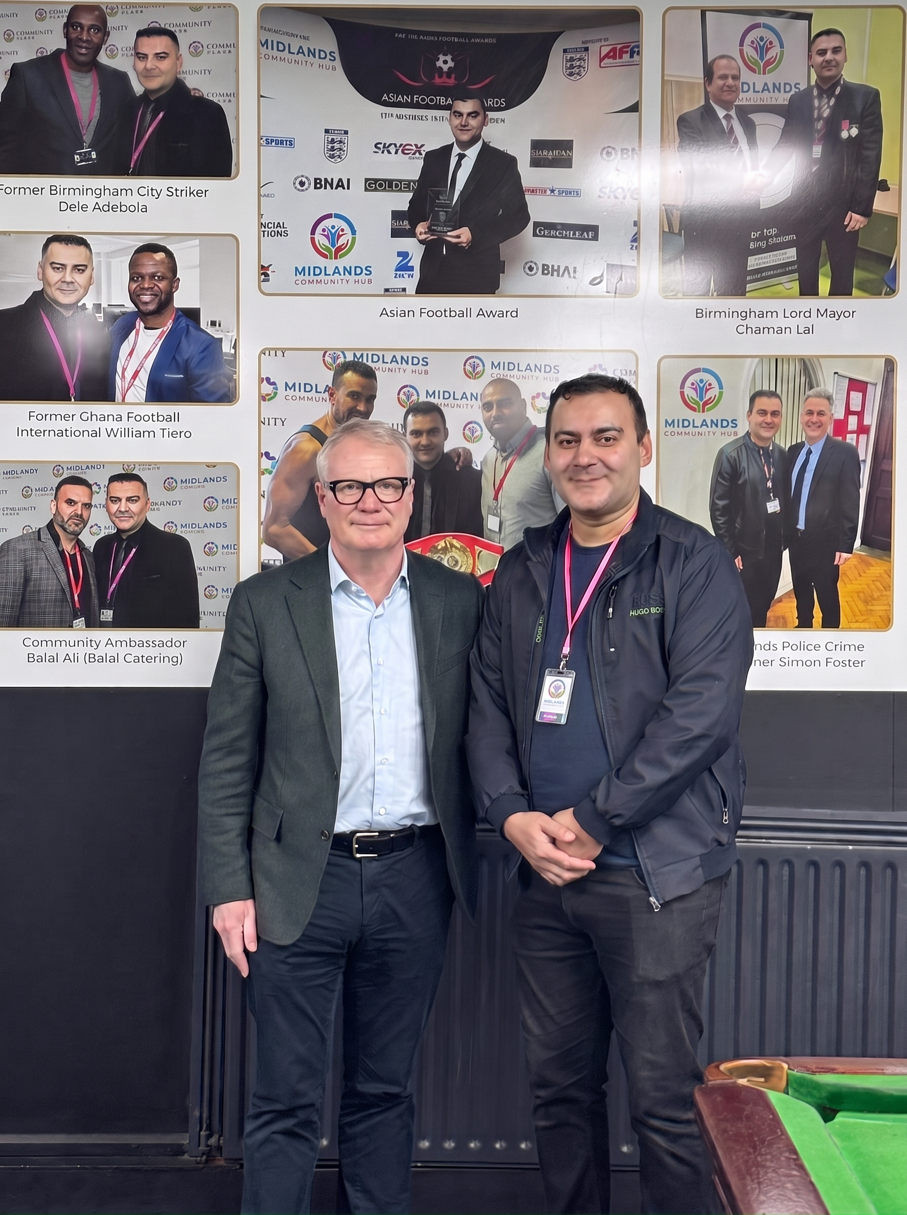 Midlands Community Hub founder with guest at awards wall