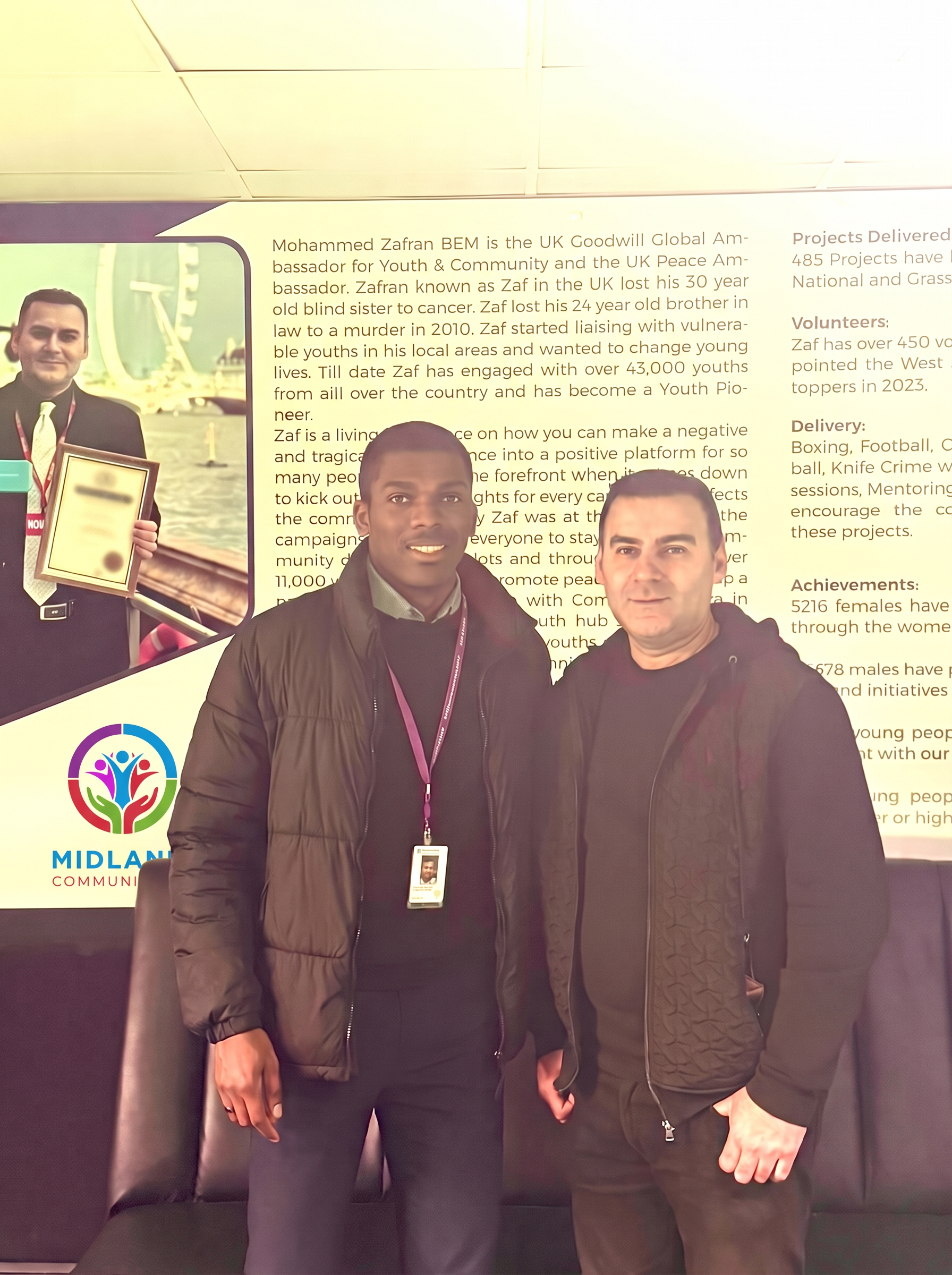 Midlands Community Hub success stories wall with visitor