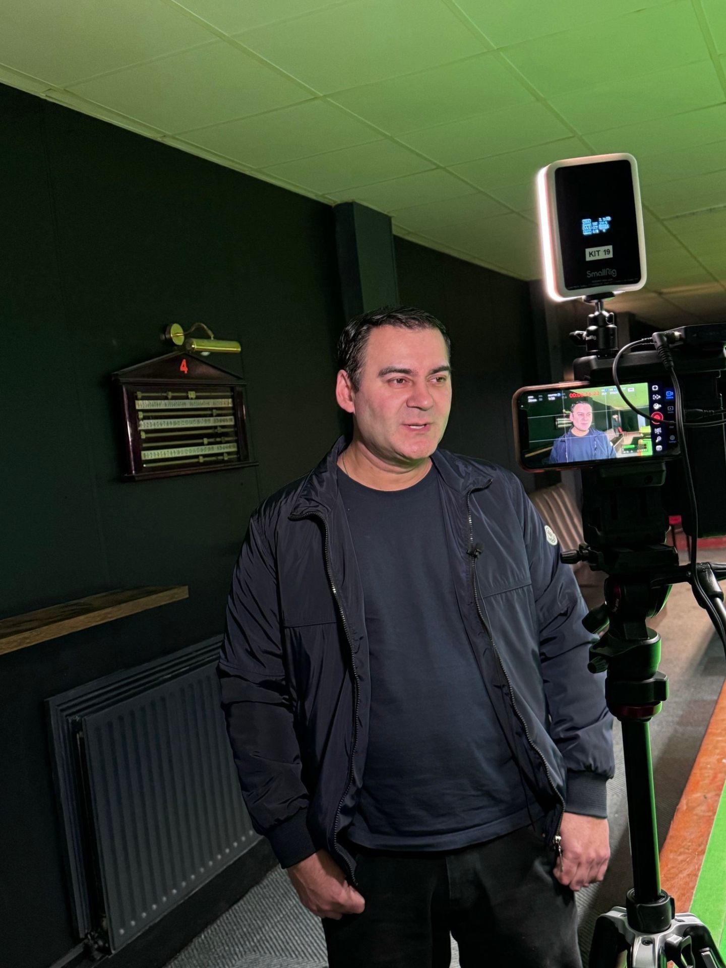 Mohammed Zafran filming community message at the Plaza