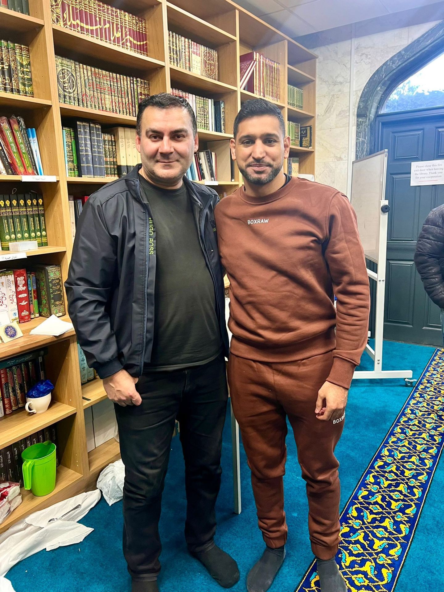 Mohammed Zafran with boxer Amir Khan at the mosque library