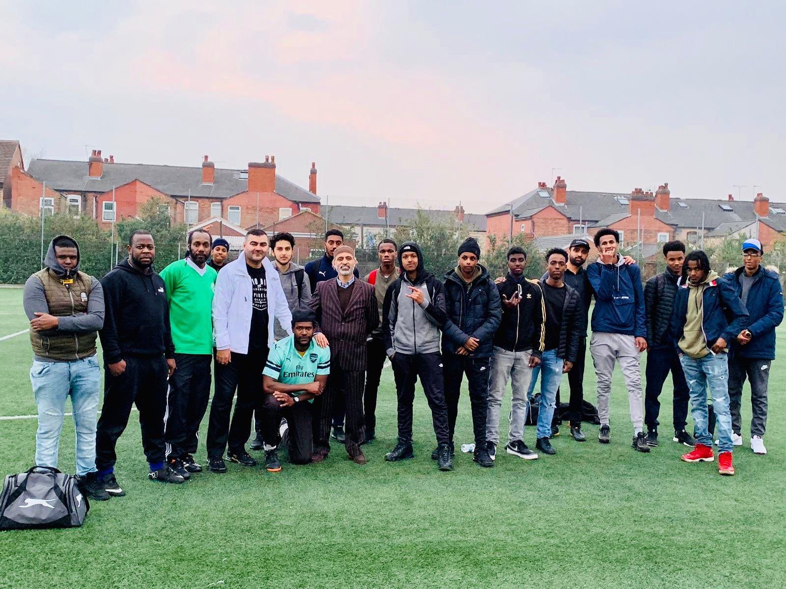 Mohammed Zafran with young footballers at a Birmingham community pitch