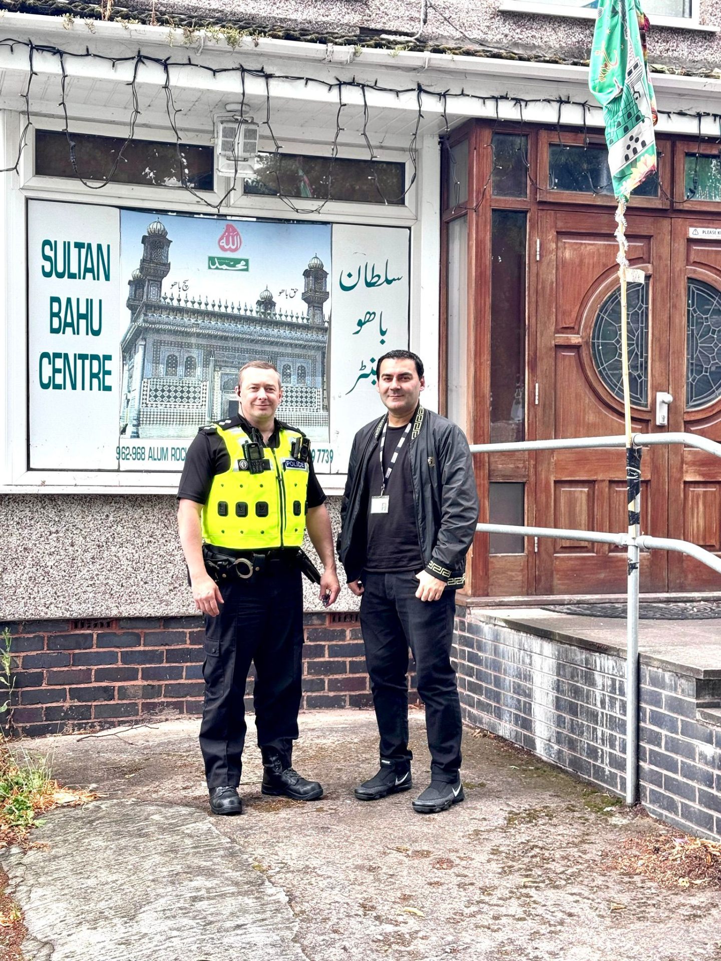 Mohammed Zafran with West Midlands Police officer at Sultan Bahu Centre